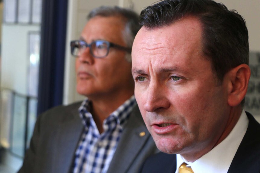 Headshot of Mark McGowan with Geoff Gallop in the background.