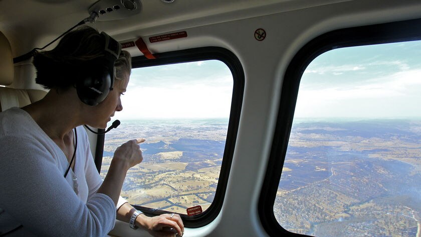 NSW Premier Kristina Keneally flies over bushfire-affected areas.