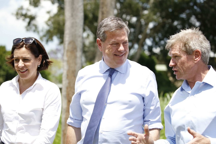 Tim Nicholls, Deb Frecklington and Jim McDonald chat in a field