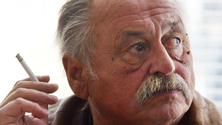 Jim Harrison smoking a cigarette.