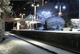 A train station with snow cover
