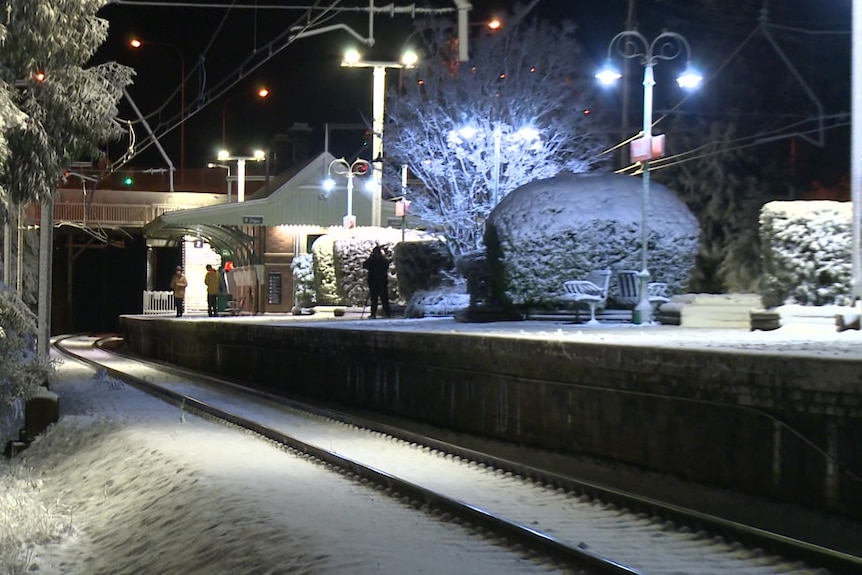 A train station with snow cover