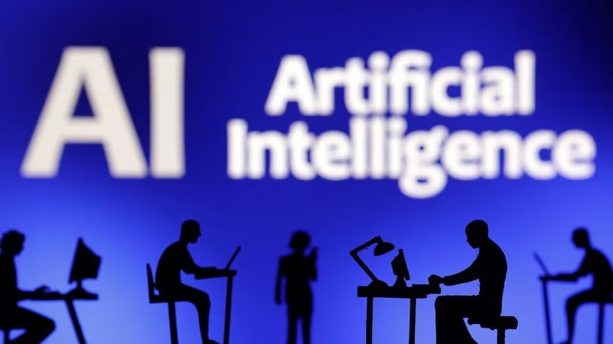 Figurines with computers and smartphones are seen in front of the words "Artificial Intelligence AI" in this illustration.