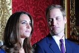 Prince William looks at Kate Middleton during a photocall to mark their engagement