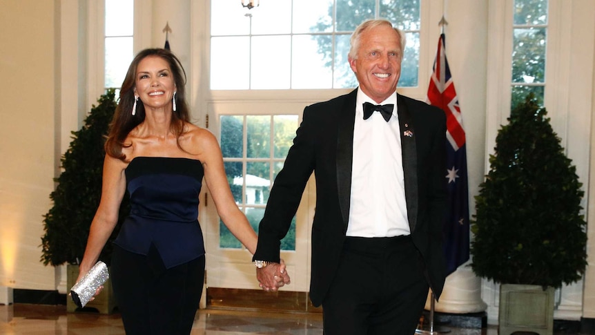 Greg Norman holds hands with wife Kirsten Kutner as they walk into a state dinner at the White House.