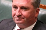 Close up of Barnaby Joyce sitting on the front bench in the House or Representatives chamber.