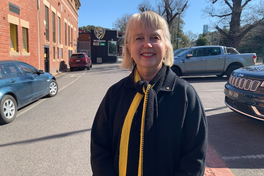A photo of Peggy O'Neil wearing black and yellow.
