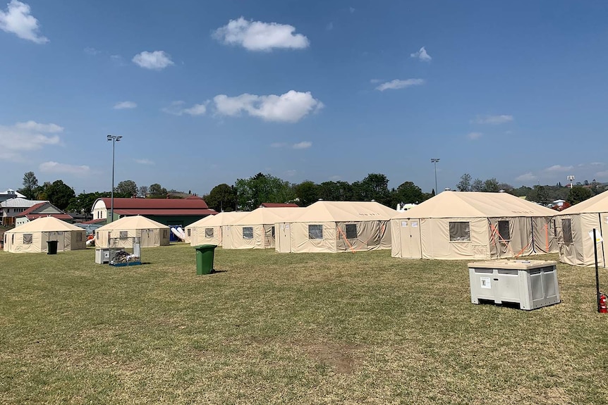 Temporary air-conditioned crew tents housing firefighters and volunteers.