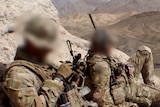 3 Squadron SAS soldiers rest on a mountain in Afghanistan in 2012.