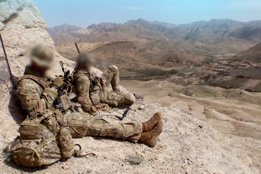 3 Squadron SAS soldiers rest on a mountain in Afghanistan in 2012.