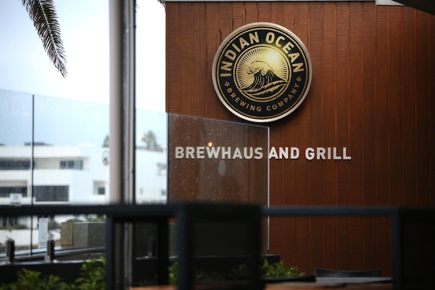 A sign on a wall at Indian Ocean Brewing Company in Mindarie.