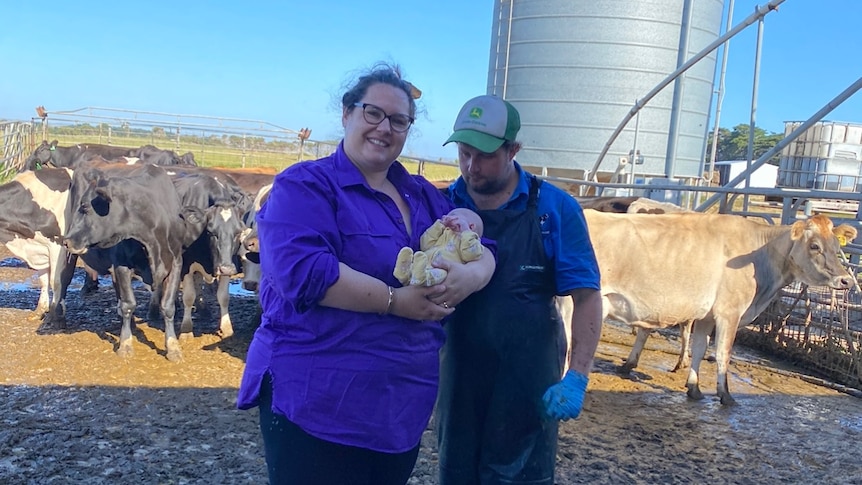 The Honeysett family standing with their cows.