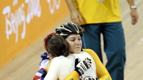 Anna Meares and Victoria Pendelton hug after the women's sprint final