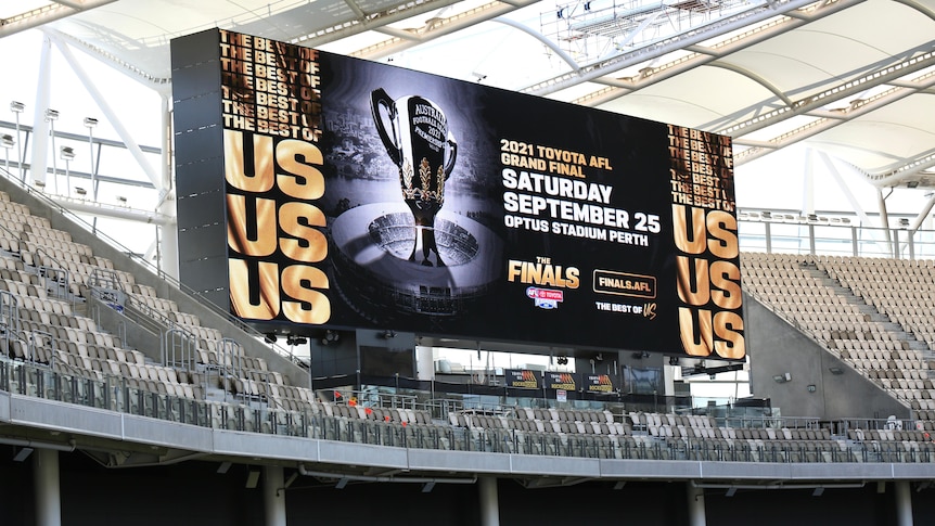 A large electronic sign promoting the AFL grand final at Perth Stadium.