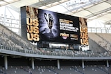 A large electronic sign promoting the AFL grand final at Perth Stadium.