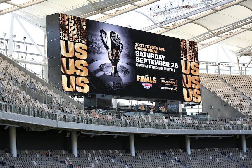 A large electronic sign promoting the AFL grand final at Perth Stadium.