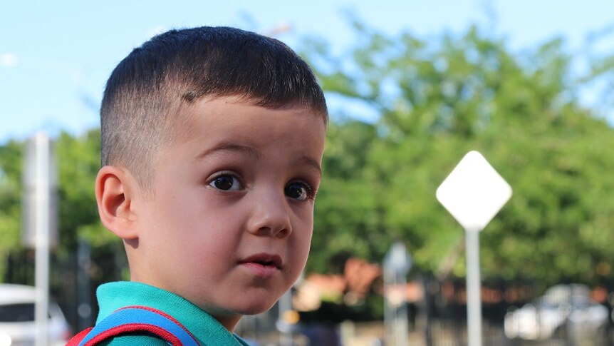 A photo portrait of Elijah on his first day of kindergarten.