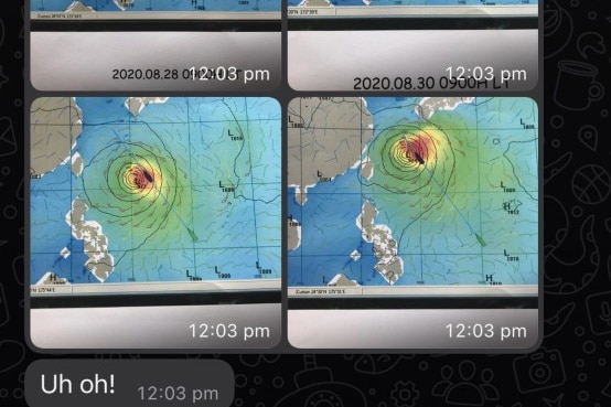 A mesage shows maps of bad weather and a grimacing emoji.