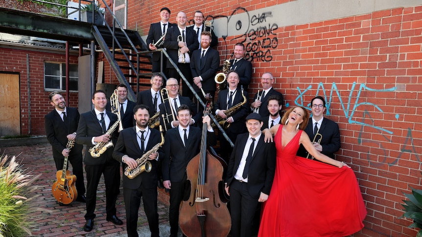 Group photo of Rhonda Burchmore & The Jack Earle Big Band on a stairwell. 