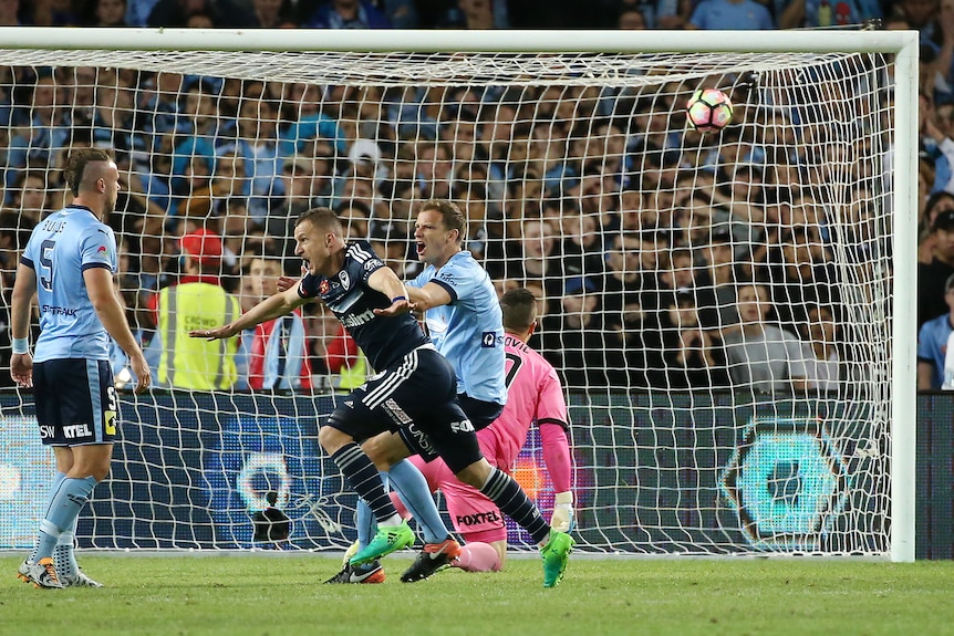 Besart Berisha (C) celebrates scoring the first goal during the A-League grand final.
