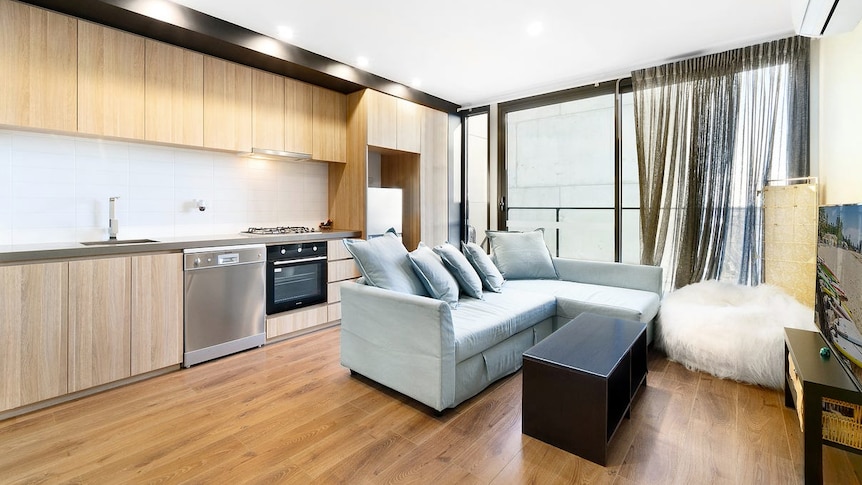 The combined kitchen and living room of a small one-bedroom apartment