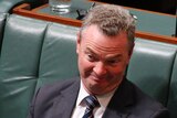 Defence Minister Christopher Pyne pulls a face as he listens in the House of Representatives