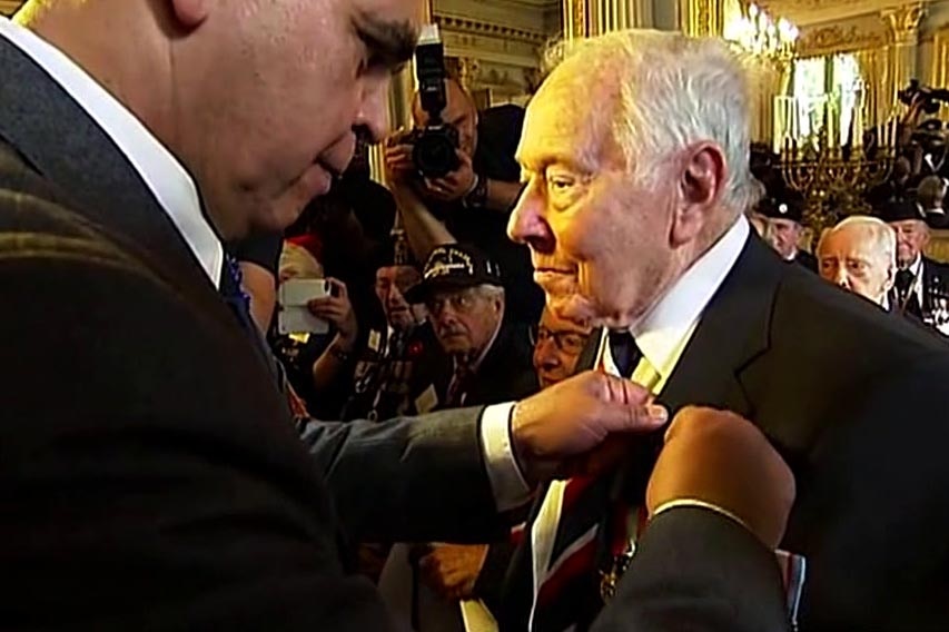 Phil Elger receives his Legion of Honour during a ceremony in the town of Caen in Normandy.