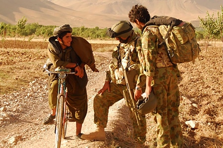 Australian soldiers talk to local Afghan man