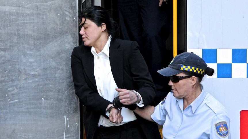 Katherine Abdallah is escorted from a prison transport vehicle at the Supreme Court of NSW in Sydney.