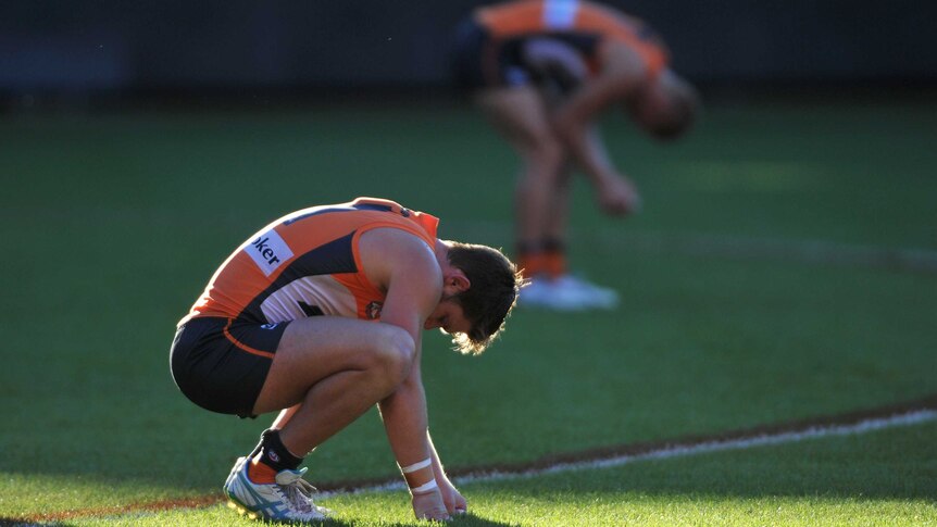 Greater Western Sydney Giants' Taylor Adams (left) and Adam Treloar look dejected after losing to the Adelaide Crows