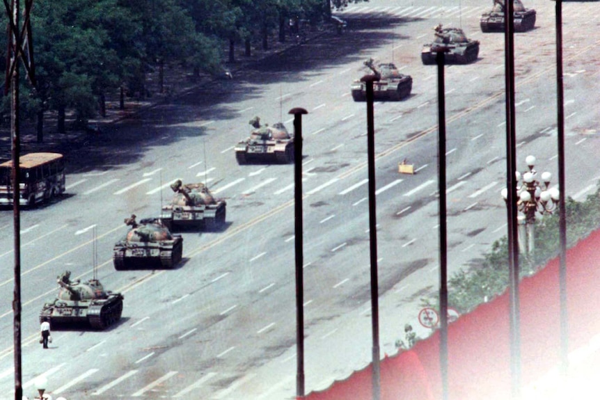 In this June 5, 1989, file photo, Chinese troops and tanks gather in Beijing, one day after the military crackdown.