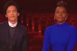 Issa Rae and John Cho announcing the 2020 Oscar nominees for best directing.