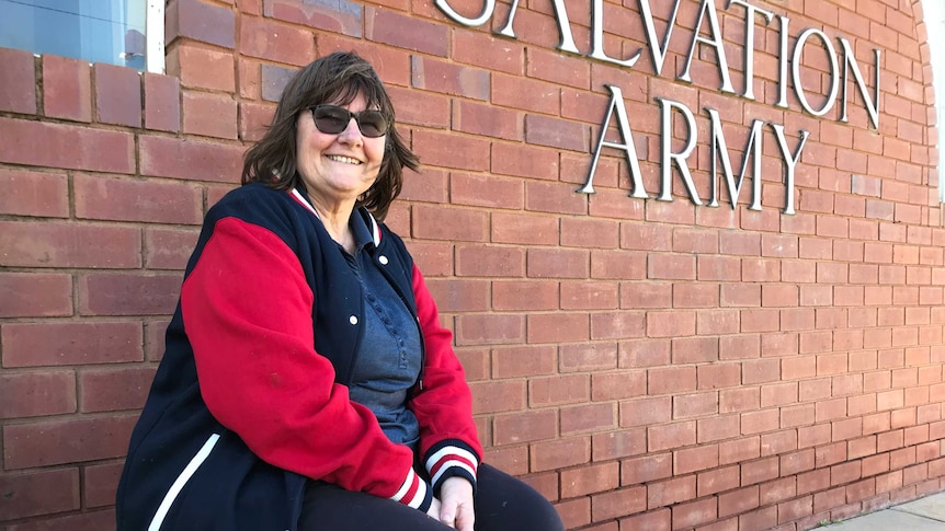 Salvation Army Major Lyn Cathcart sits outside Salvos building in Griffith