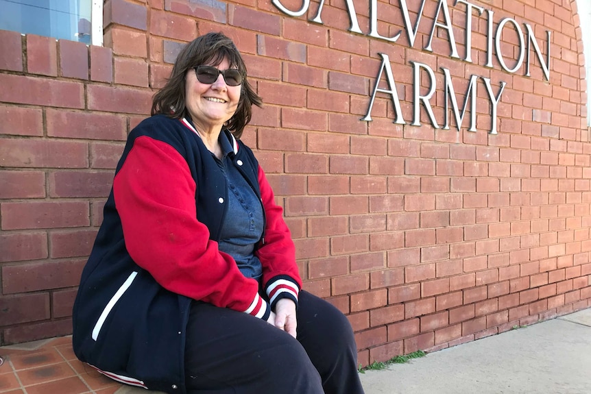 Salvation Army Major Lyn Cathcart sits outside Salvos building in Griffith