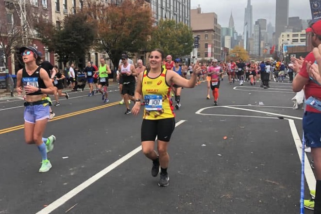 People running in a street in New York 