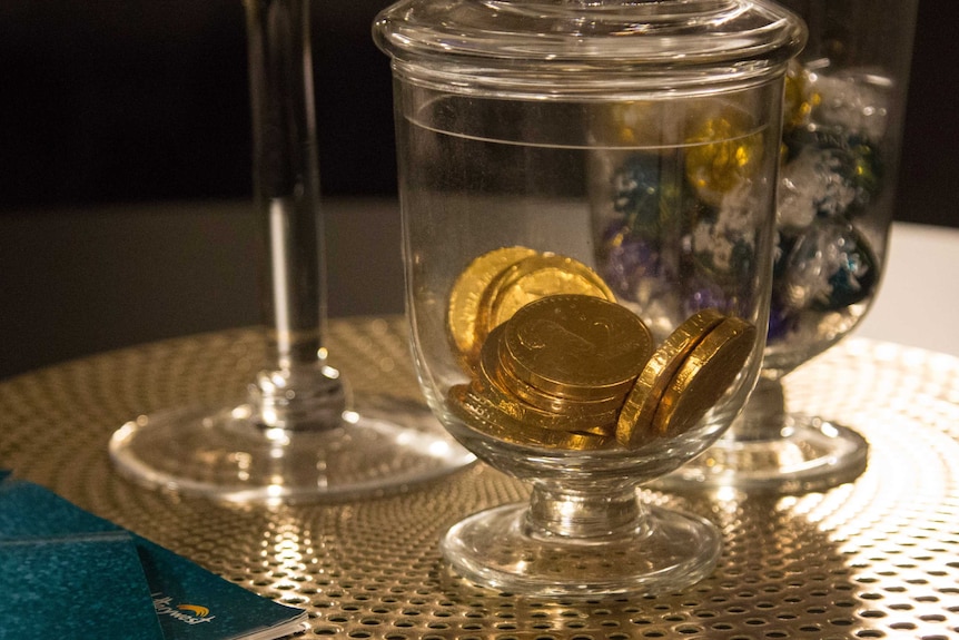 Gold coin chocolate in a jar