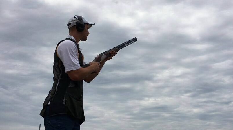 Sam Bylsma holding a rifle
