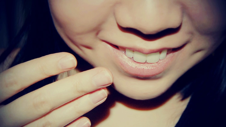 A close up of a girl smiling.