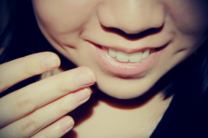 A close up of a girl smiling.