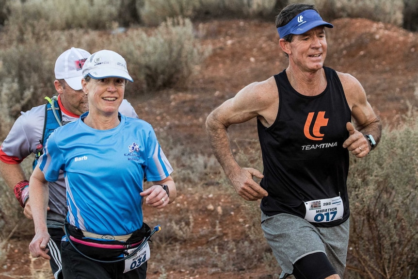 Runners in marathon on dirt track