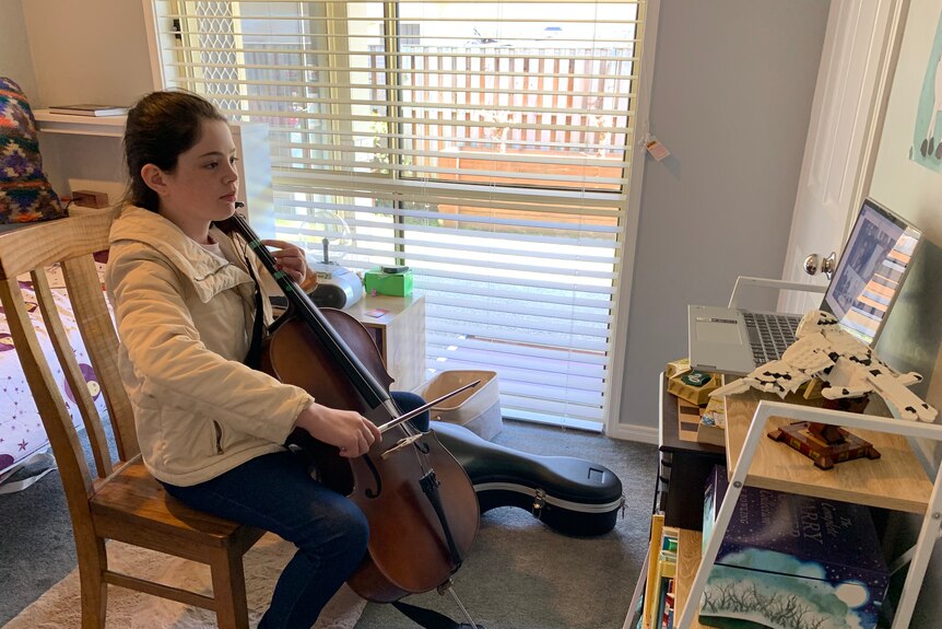 Young girl playing an instrument.