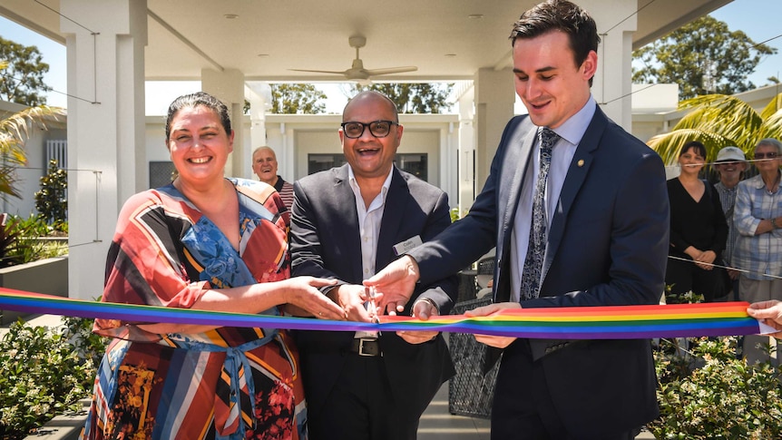 The rainbow ribbon celebrating the opening of an LGBTI aged care facility in Parkwood is cut