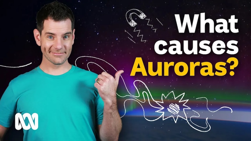Nate Byrne points his thumb towards text that reads 'What Causes Auroras?'