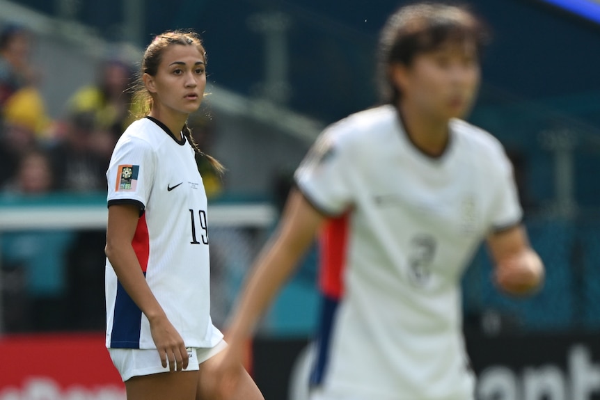 Casey Phair walks onto the field for South Korea at the FIFA Women's World Cup.