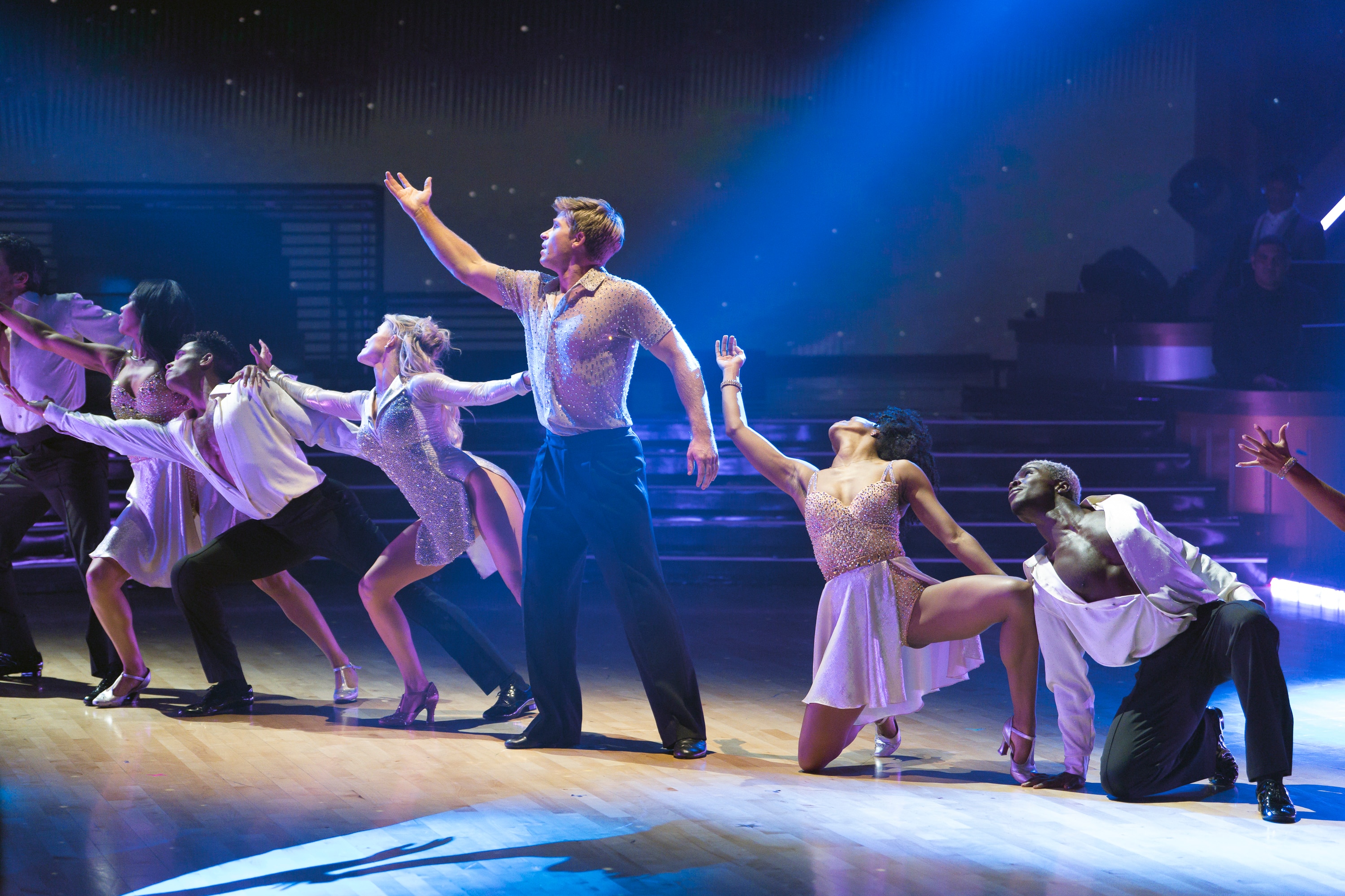Robert Irwin dances on stage with multiple backup dancers