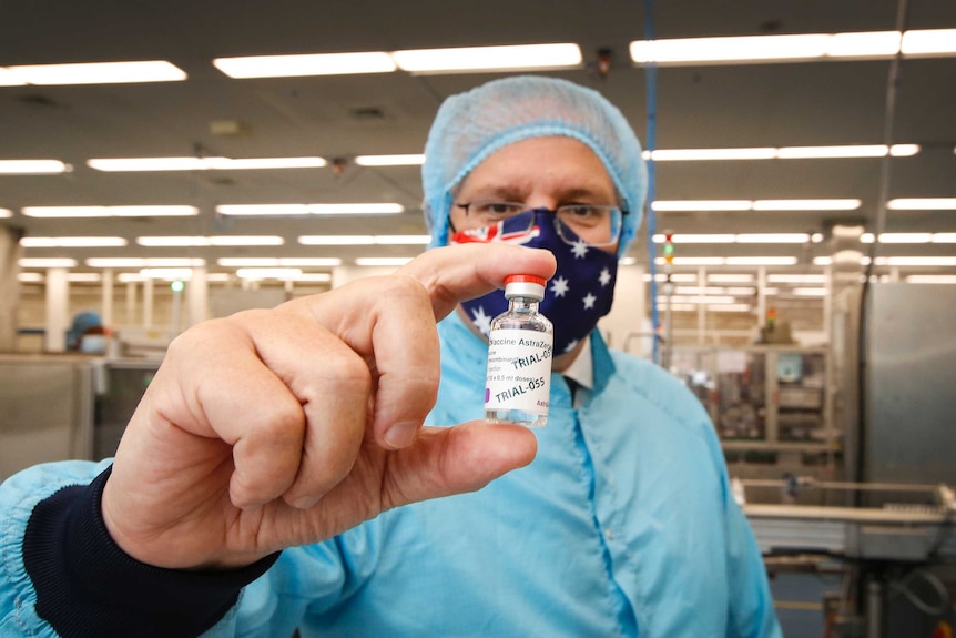 Prime Minister Scott Morrison with a vial of the AstraZeneca vaccine.