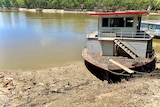 A house boat on the banks of a river