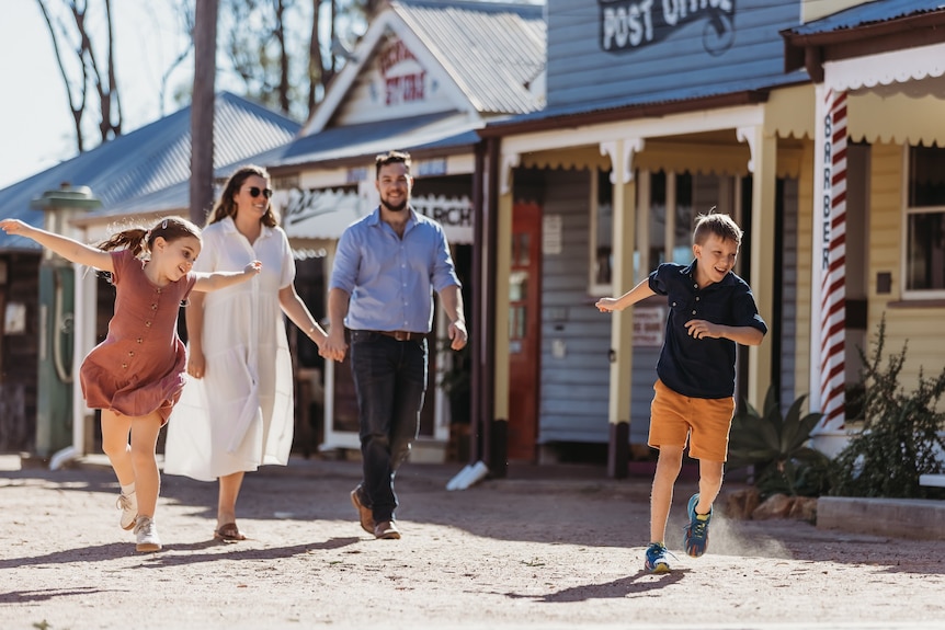 family walking through historical village in Miles