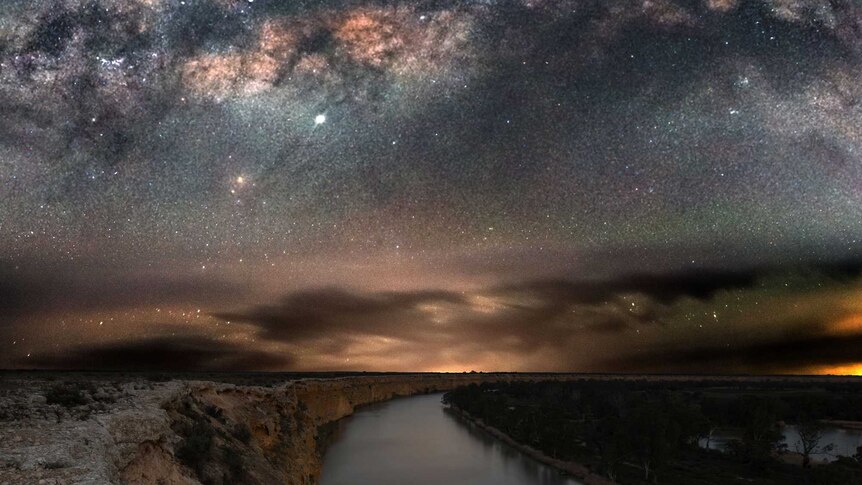 A body of water captured under the night sky.
