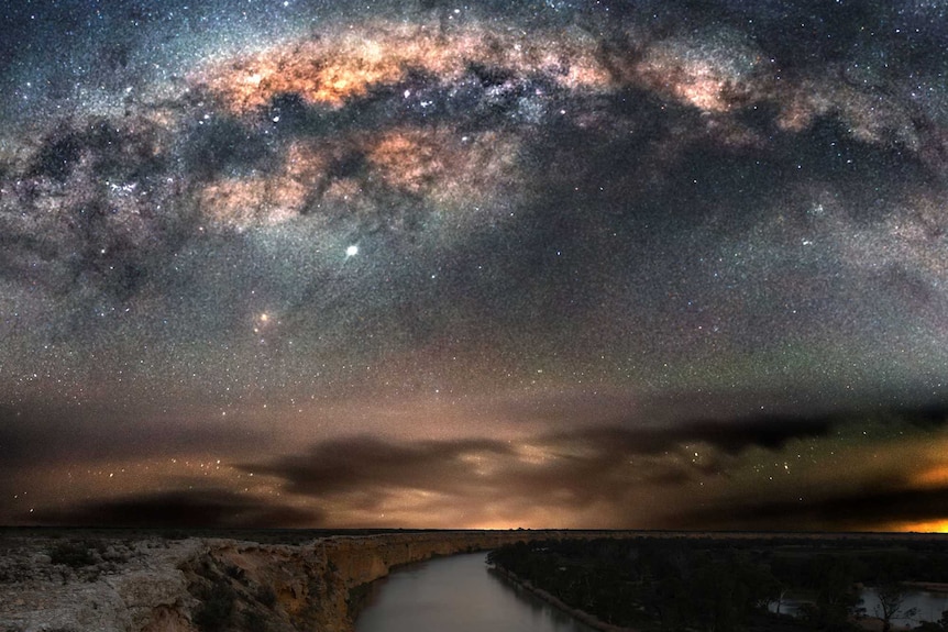 A body of water captured under the night sky